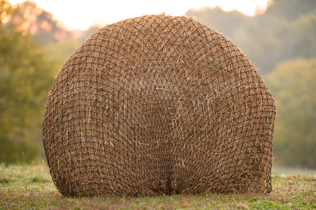 How to Put a Hay Net on a Round Bale